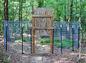 Corral Trap Outfitted with a Single-catch Wooden Drop
                                                Door