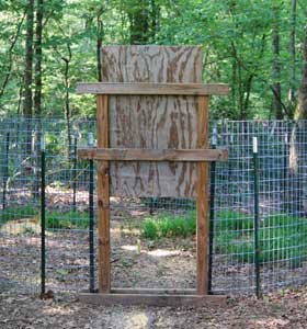 Outside View of the Poor Man's Drop-Style or Guillotine Wooden
                                        Trap Door